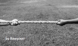 closeup-hand-pulling-rope-tug-war-game.jpg